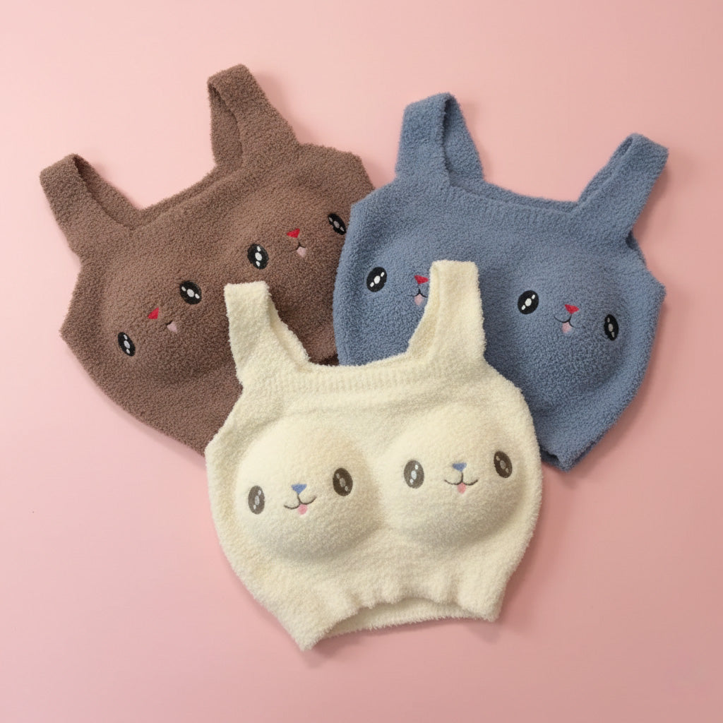 Three cartoon-style bra covers in brown, blue, and beige 