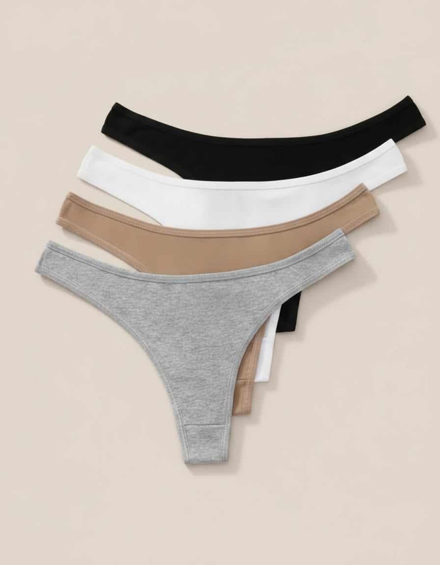 Four pairs of women's underwear in black, white, beige, and gray on a beige background.